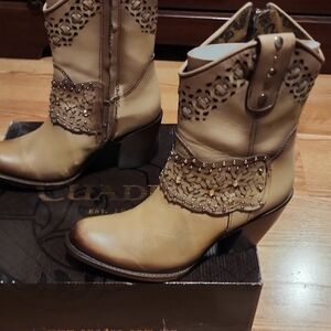 Chic Beige Heeled Boots with Intricate Cutout Design